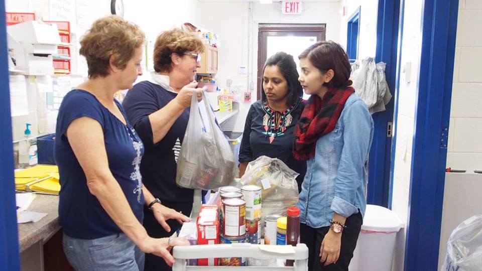 Facebook/Campus Pop Up Pantry Sheila (second from left) learning about the Pop Up Pantry.